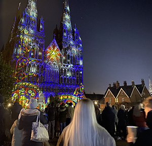 Image shows crowds enjoying the Christmas Light Show at Lichfield Cathedral